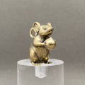The mouse holding a peach Brass Crafts Desktop Ornaments